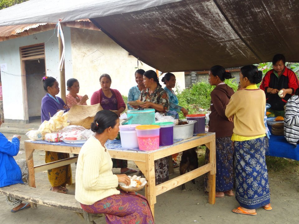 Balinese women eating together.