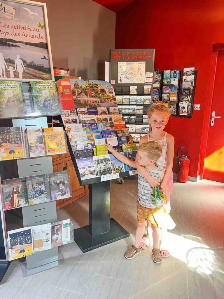 Children on holiday look at the reception area at Camping La Garangeoire