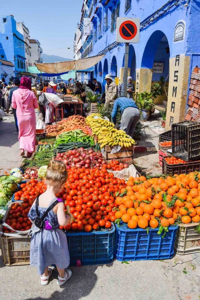 Young girl exploring Chefchaouen market