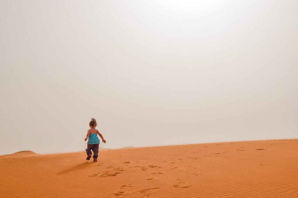 Child walks across Sahara Desert