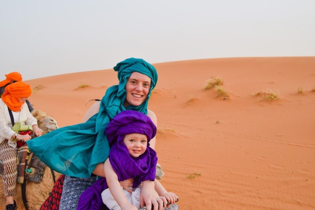 Child riding on camel