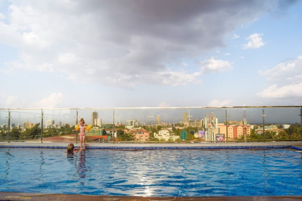 Mother and young daughter enjoy the rooftop pool at Four Points by Sheraton