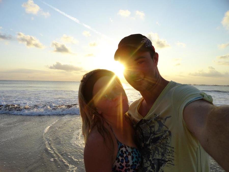 Couple enjoy the sunset over Jimbaran Beach