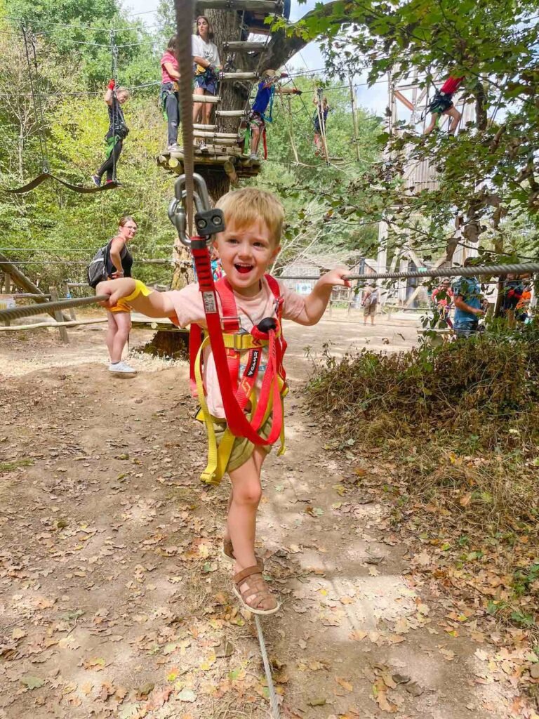 Boy has fun at Le Grand Defi Adventure Park Vendee