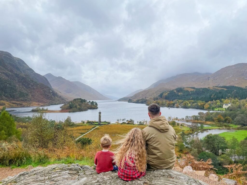 Father and his two children look out over Loc