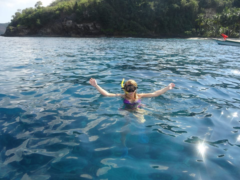 Lady snorkels off Nusa-Lembongan island