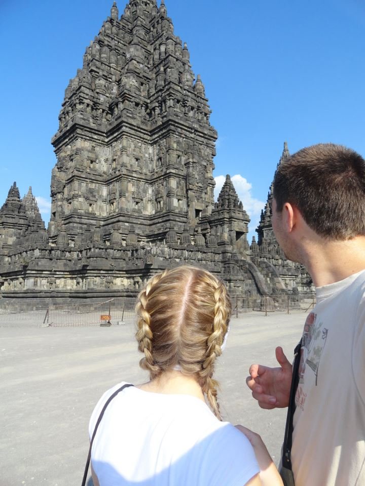 A couple stand admiring Prambanan Temple