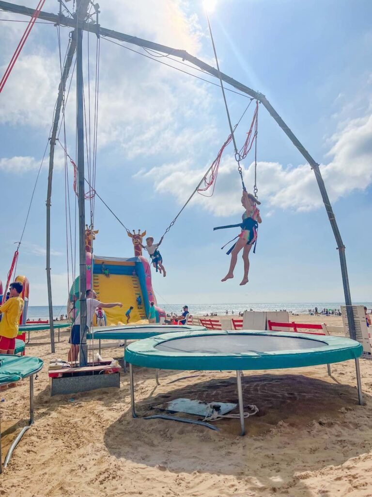 Children playing in the trampolines at Saint Jean de Mont Beach