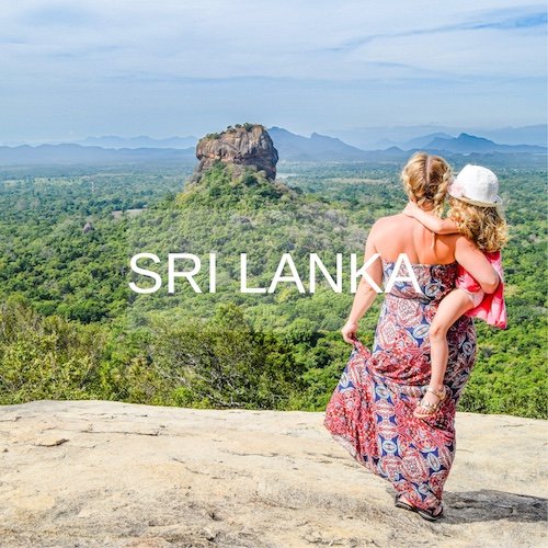 Mother and daughter stand looking over Sigiriya rock, Sri Lanka