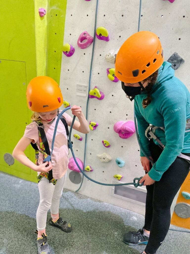 Young girl climbs at three Wise Monkeys Climbing Centre Fort William