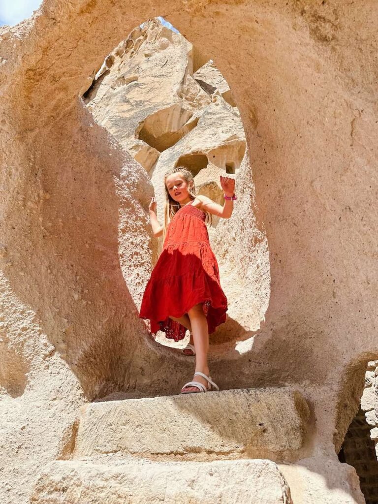 Young girl exploring Cappadocia rocks